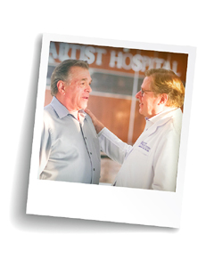 Doctor speaking with patient outside hospital