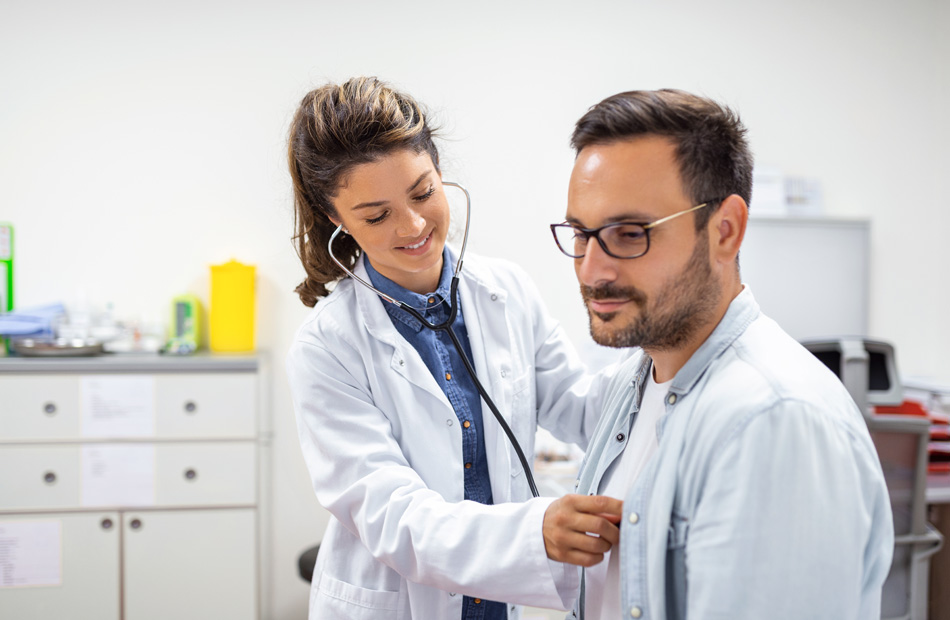 Clinician using stethoscope on patient