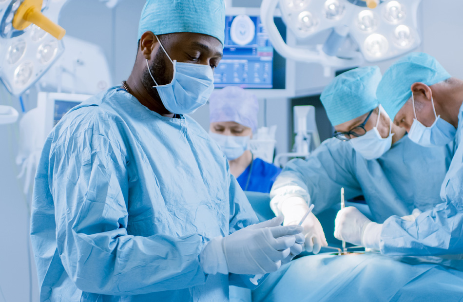 A doctor holds a tablet computer and discusses medical care options with a patient
