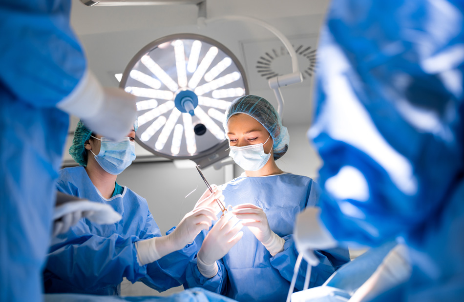 A doctor holds a tablet computer and discusses medical care options with a patient